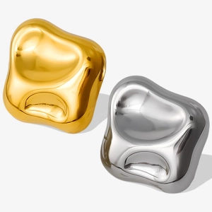 Detailed view of irregular 304 stainless steel earrings in polished gold and silver finishes