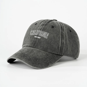 Washed dark grey baseball cap with white CALIFORNIA WEST COAST embroidery at 45-degree angle
