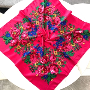Detail of vintage floral pattern on rose red cotton linen square scarf with vibrant blooms