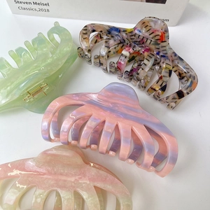 Large acetate hair clips in four colors including floral and marble patterns for women