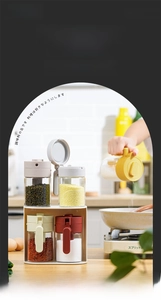 Detail showing the two-in-one glass seasoning jar with lid and integrated spoon design