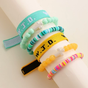 Detail of WWJD woven band and colorful clay bead bracelets with a cross charm