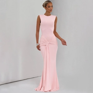 Detail of pink sleeveless maxi dress featuring a twisted waist and elegant draping