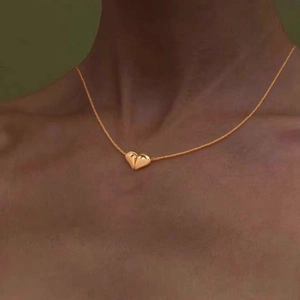 Elegant gold heart pendant necklace for women worn on neck for a stylish accessory look