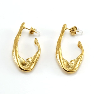 Irregular textured 18K gold plated stainless steel earrings with organic lava-like design