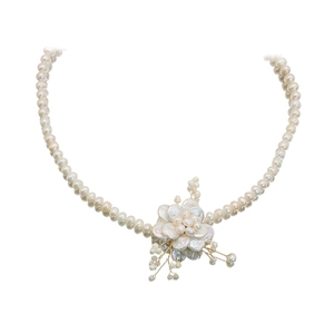 Baroque petal necklace featuring natural freshwater pearls and golden metal flower pendant