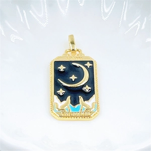 Detailed macro view of the gold plated Moon Tarot card pendant with black enamel