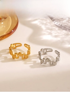 Detail of adjustable geometric 18K gold and silver hollow rectangle rings