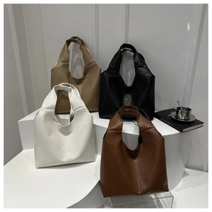 Minimalist woven faux leather tote bags in black, white, brown and khaki on display
