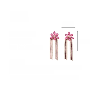 Detail showing pink rhinestone flower earrings with long fringe and 11.7cm size specs