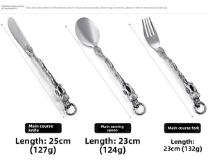 Detailed view of punk style stainless steel cutlery with dragon relief handle handles