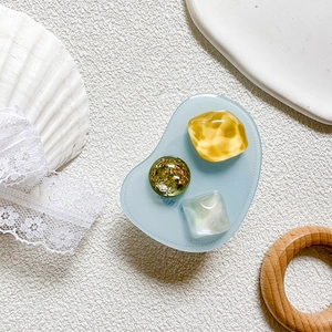 Detailed view of luxury resin phone socket with pearl gems and gold foil accents