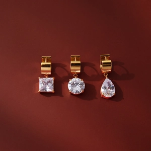 18K gold stainless steel earrings with princess, round, and pear cut cubic zirconia
