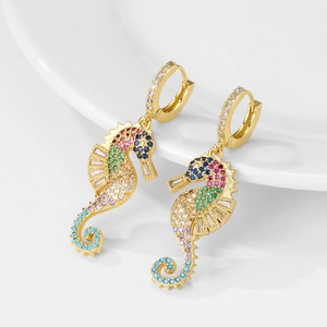 Gold-plated seahorse earrings with colorful cubic zirconia stones on a white background