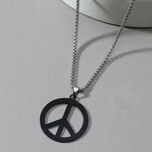 Men's stainless steel necklace with matte black peace sign pendant on grey background