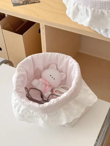 Pink checkered fabric storage basket with lace edges and delicate bow embroidery