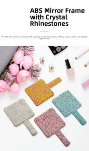 Close-up of four glittery heart-shaped rhinestone handheld mirrors on marble surface