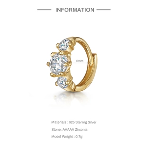 Detail view of 6mm gold-plated 925 silver earring set with three white cubic zirconia stones