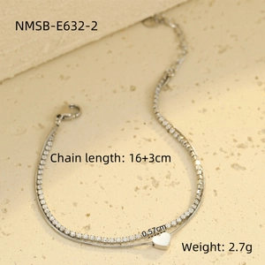 Detailed view of silver double-layered snake chain with zircon and heart pendant