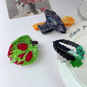 Creative Halloween acetate hair claw set featuring poison apple and witch designs
