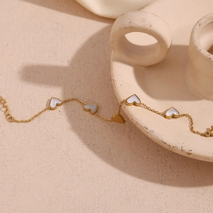 18K gold plated stainless steel bracelet with five white shell heart pendants