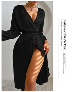 Detailed view of black satin long-sleeve robe featuring a glossy finish and belted waist
