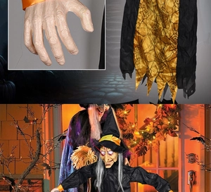 Detailed view of scary hanging Halloween witch with glowing red eyes and resin hands
