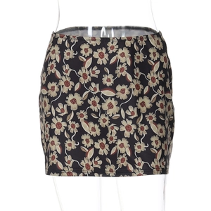 Detailed view of floral print pattern on a high waist slim fit black mini skirt
