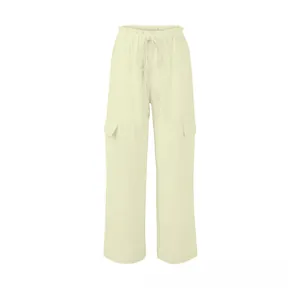 Detail view of cream linen cargo pants with drawstring waist and side flap pockets