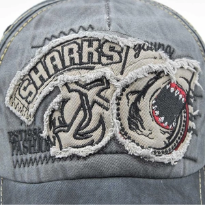 Vintage dark grey washed cotton baseball cap with embroidered shark patch design