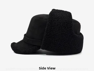 Side view of black thermal trapper hat featuring faux suede exterior and thick fleece lining