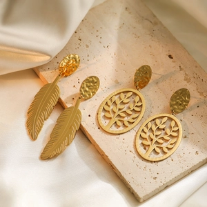 Golden vintage leaf and tree of life earrings with hammered texture on beige stone