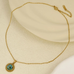 304 stainless steel sun pendant necklace with natural white shell on white texture background