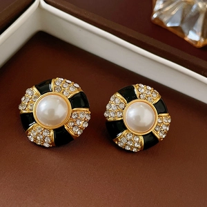 Vintage black enamel and pearl stud earrings with gold plating and cubic zirconia