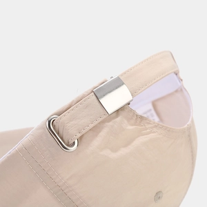 Detail of adjustable metal buckle and breathable quick-dry fabric on the baseball cap