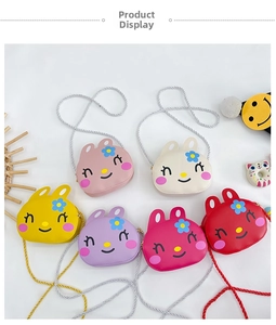 Flat lay of colorful cartoon rabbit crossbody bags for girls in six vibrant shades