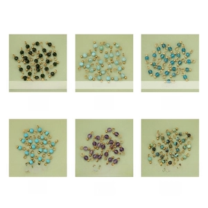 Detailed grid of faceted natural stone pendants with golden rings for DIY jewelry making