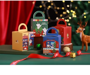 Macro shot of colorful Christmas gift boxes with handles against festive red background