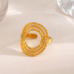 Minimalist gold tiered open ring with textured concentric circles and bamboo style detailing