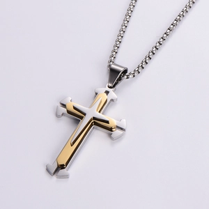 Men's two-tone silver and gold layered cross pendant necklace on a silver metal box chain