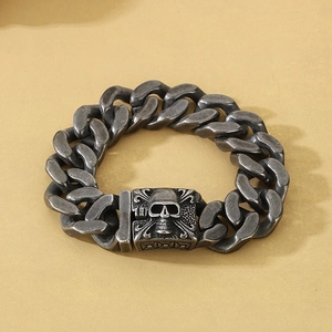 Detail of vintage silver Cuban chain bracelet featuring a 3D skull buckle design