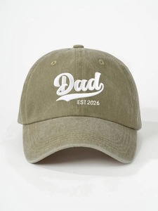 Detail of vintage olive green washed baseball cap with white Dad EST 2026 embroidery