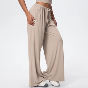 Detail of high waist beige lounge pants with elastic drawstring and soft modal fabric