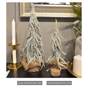 Detail of 42cm and 32cm frosted mini Christmas trees with rustic burlap bases