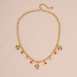 Detail of stainless steel necklace with citrus slices and colorful crystal pendants