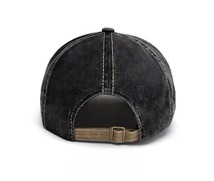 Close-up of vintage washed denim baseball cap back with adjustable metal buckle and leather strap