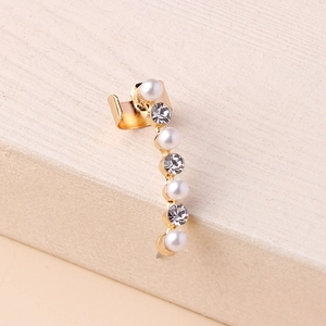 Elegant gold-tone ear cuff with hollow design, white pearls, and sparkling rhinestones