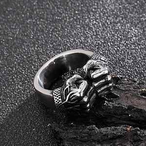 Macro detail of retro stainless steel double fist ring with a vintage silver finish