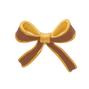 Close-up of golden bow earrings with brown enamel finish and polished metallic edges