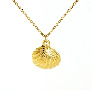 Macro view of gold shell pendant with radial texture on minimalist stainless steel chain